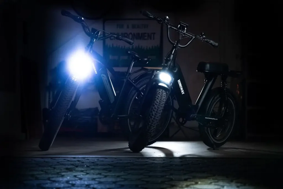 Technician installing bright LED lights on an electric bike, enhancing safety and visibility for nighttime riding, with options for stylish accent lighting.