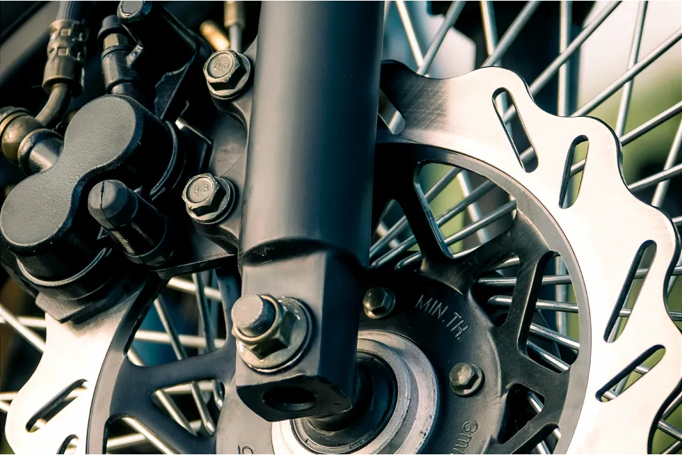Technician adjusting brakes on an eBike for enhanced safety and performance