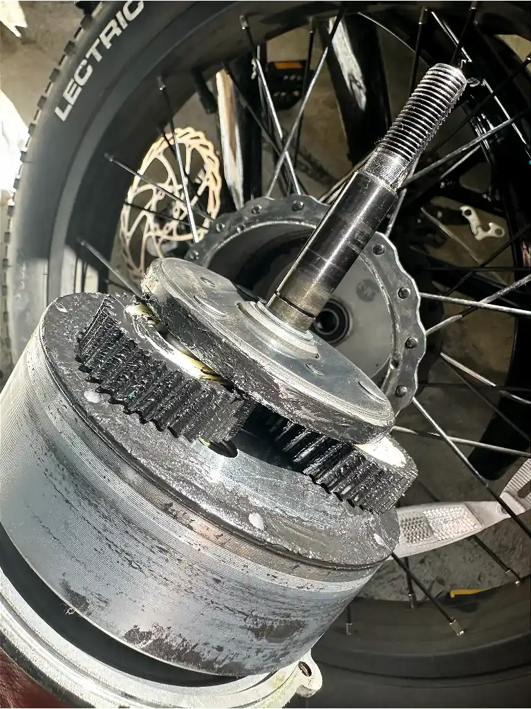 Greased planetary gears inside an electric bike hub motor during repair